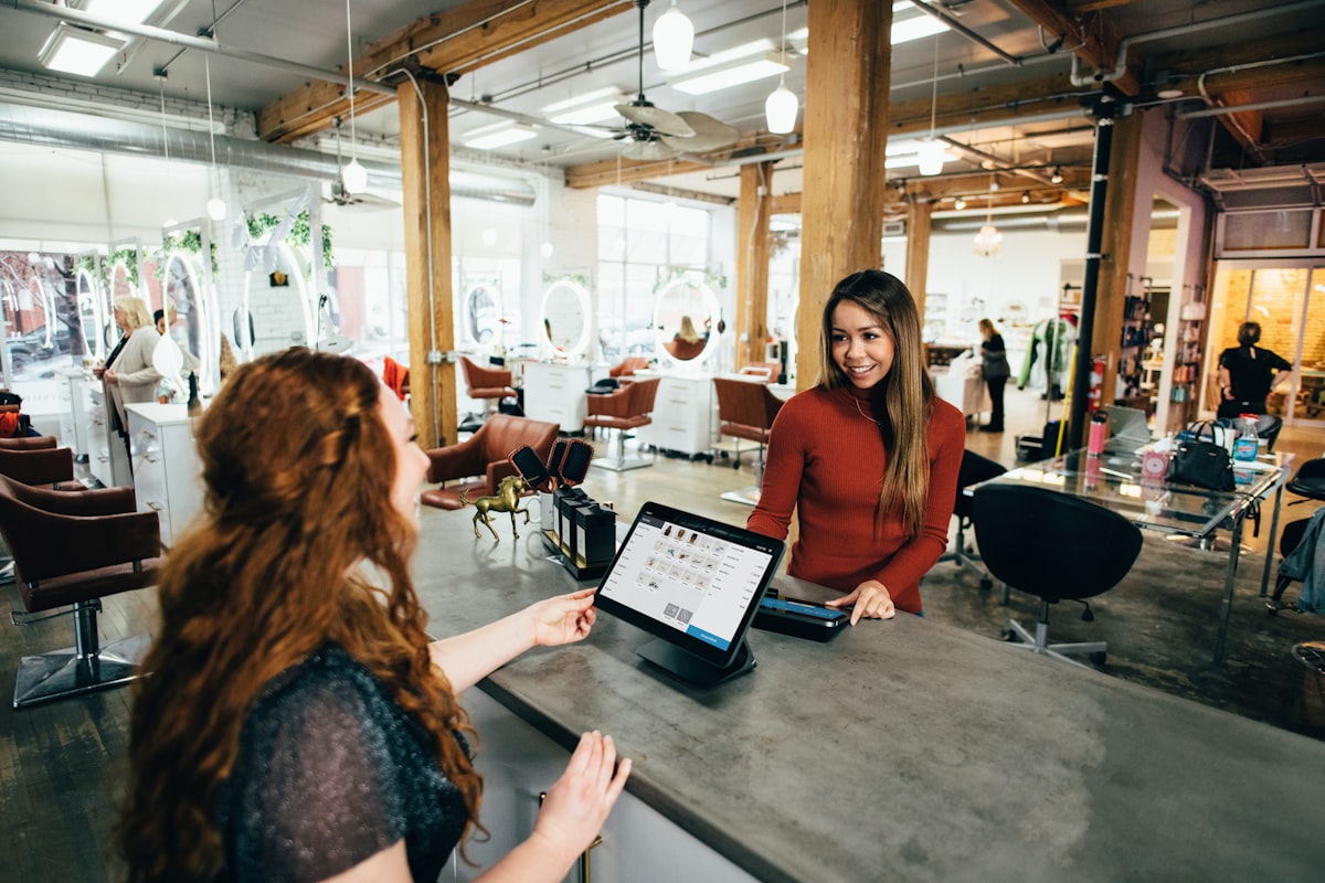 Laptop showing an online store checkout page representing WooCommerce store cost